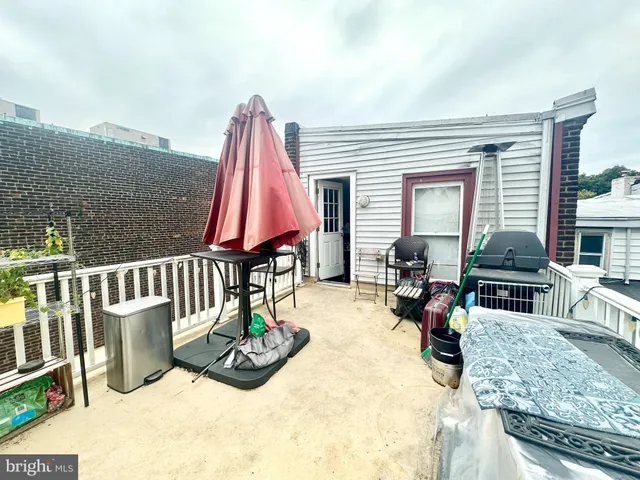 a view of a living room and a wooden floor