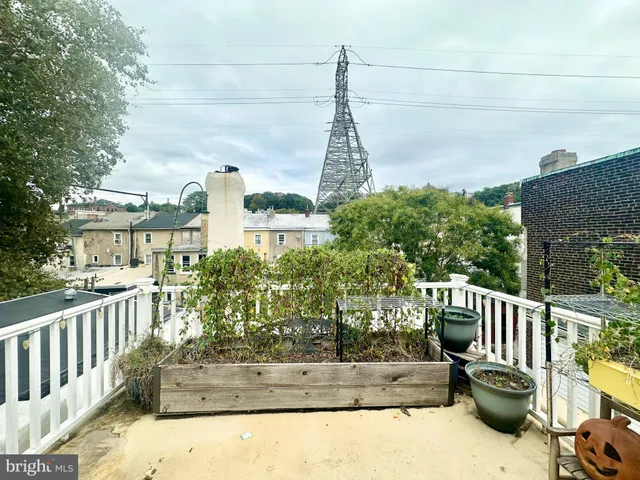 a view of a chair and tables in the balcony