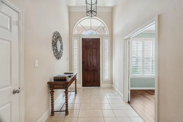 a view of a hallway with entryway door