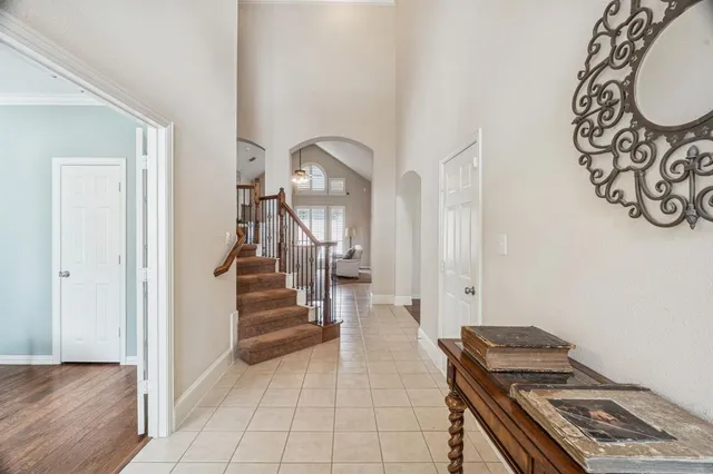 a view of an entryway with wooden floor