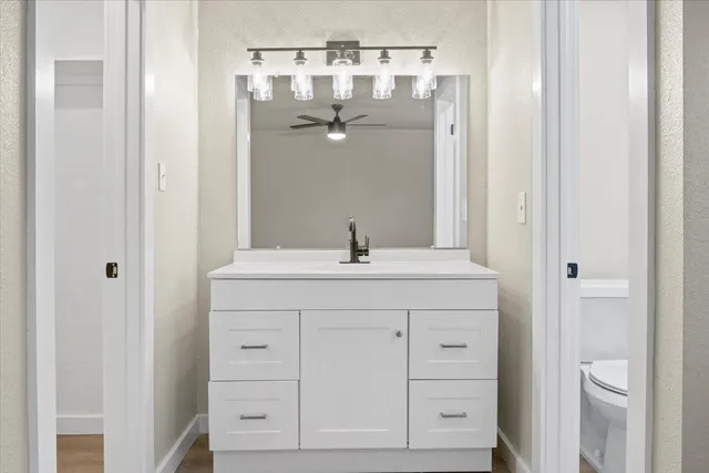 a bathroom with a double vanity sink and mirror