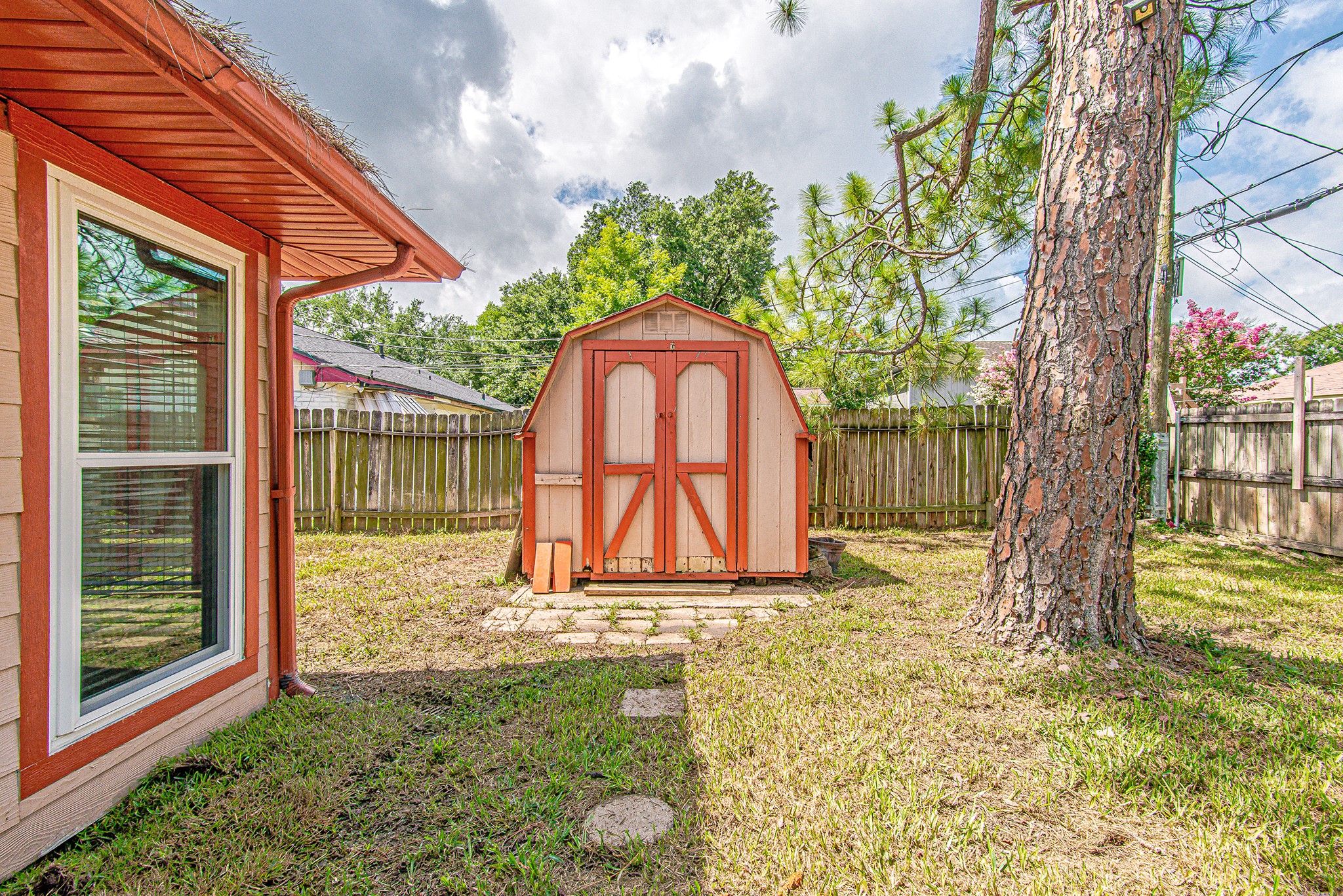 2710 Burke Road Pasadena, TX 77502 - Photo 27 of 28 Large backyard with mature trees and convenient storage shed