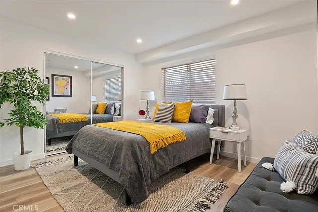 a bedroom with a bed and window