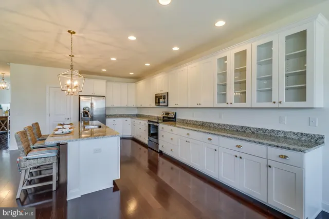 an aerial view of residential houses with outdoor space and river