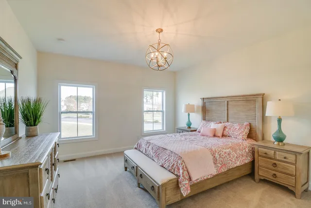 a bedroom with two beds and a window