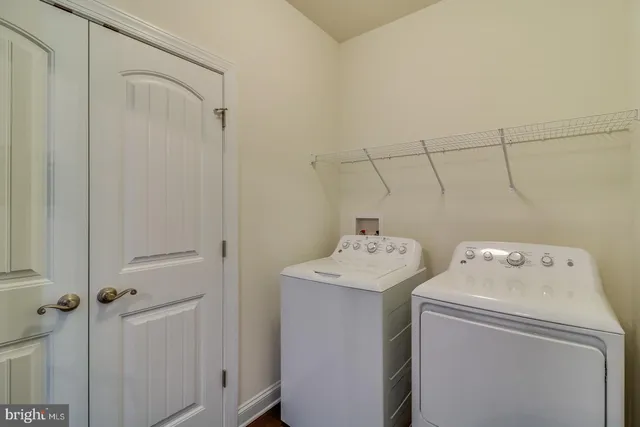 a living room with furniture a fireplace and window