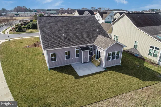 a house that has a large pool in front of it