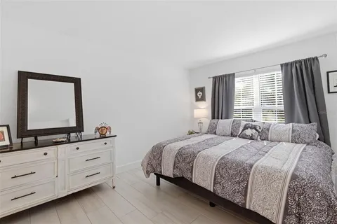 a bedroom with a bed and a dresser