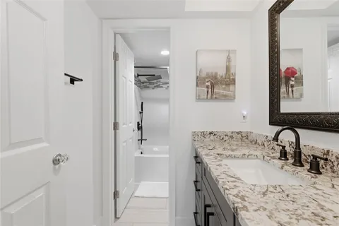 a spacious bedroom with a bed and a window