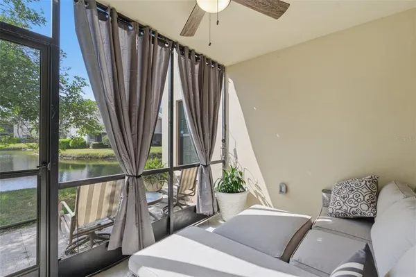 a bedroom with furniture and a potted plant