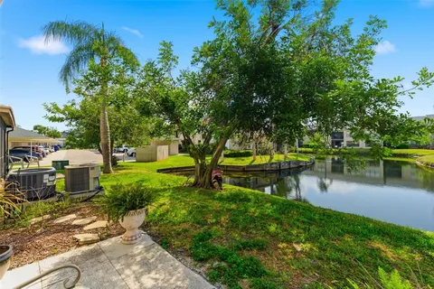 a house that has a tree in front of the house
