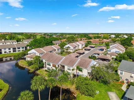 an aerial view of a house with a ocean view