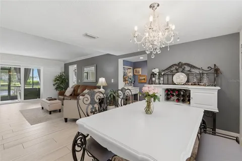 a very nice looking dining room with furniture