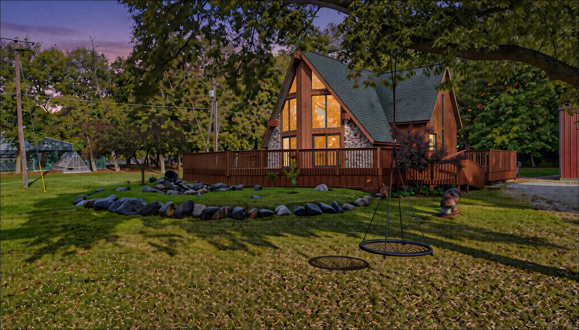 a view of a backyard with plants and a large tree