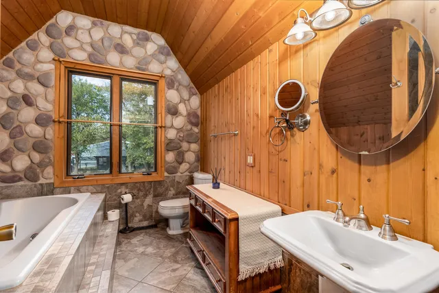a bathroom with a bathtub and shower