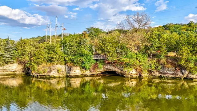 a view of a lake with houses in the back