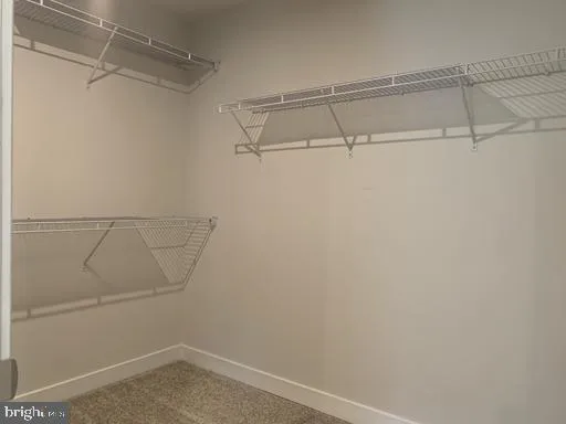 an empty room with closet area