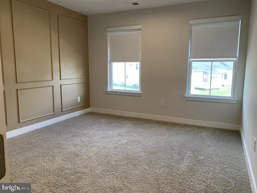 a bathroom with a granite countertop toilet a sink and bathtub