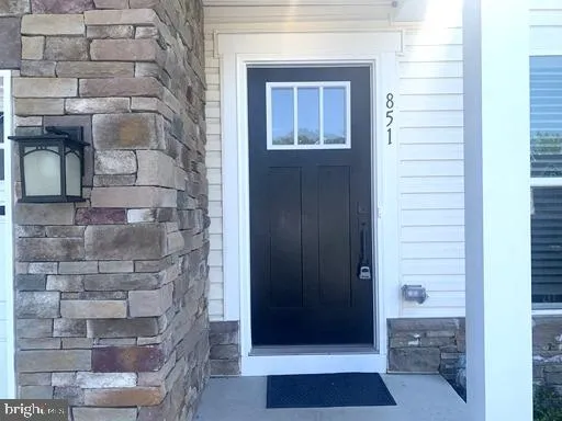 a bathroom with a glass door shower