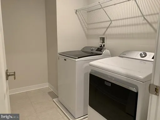 a view of an empty room with stairs