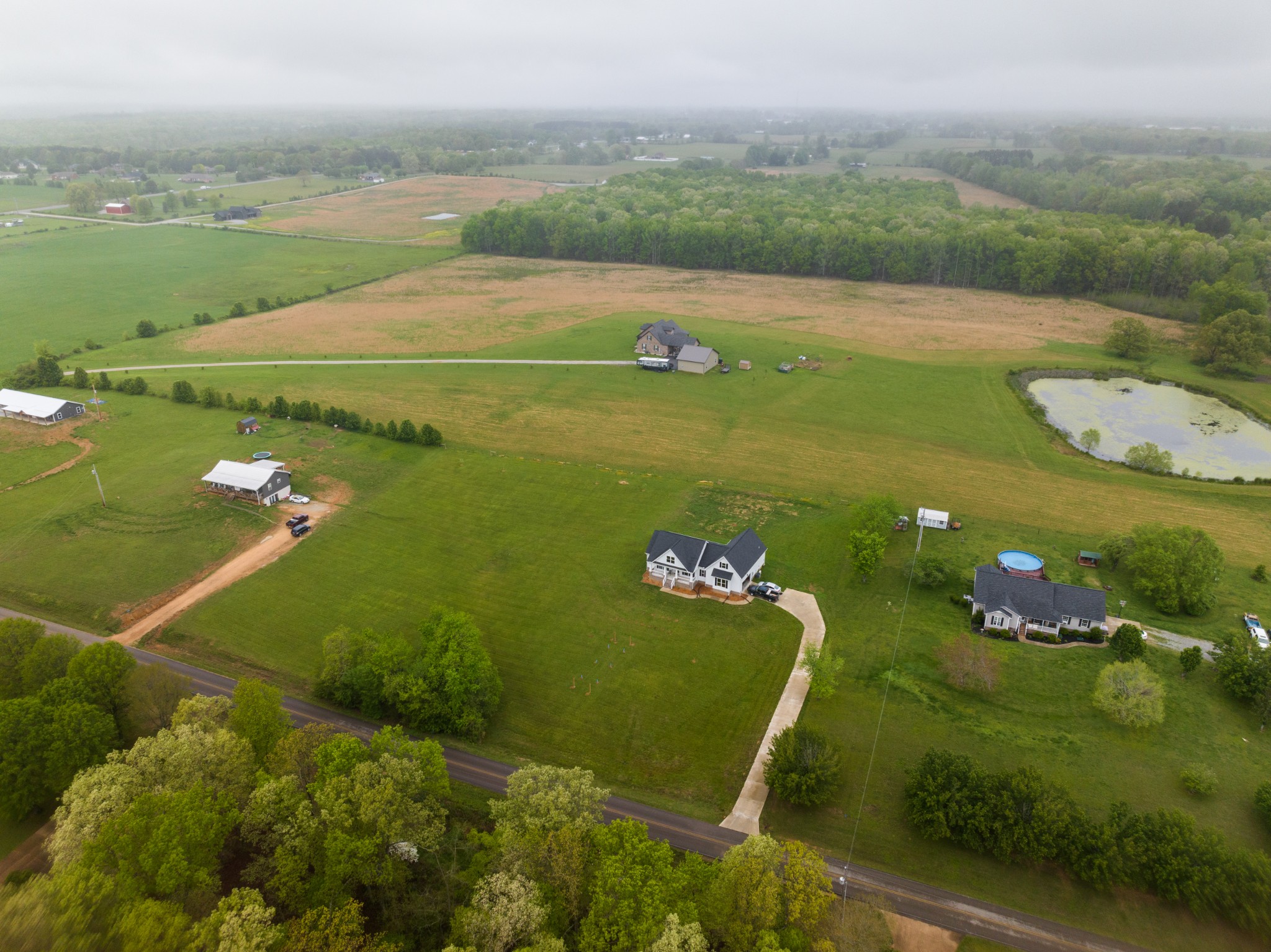 155 Colonial Road Hohenwald, TN 38462 - Photo 11 of 36 a view of a lake with a yard