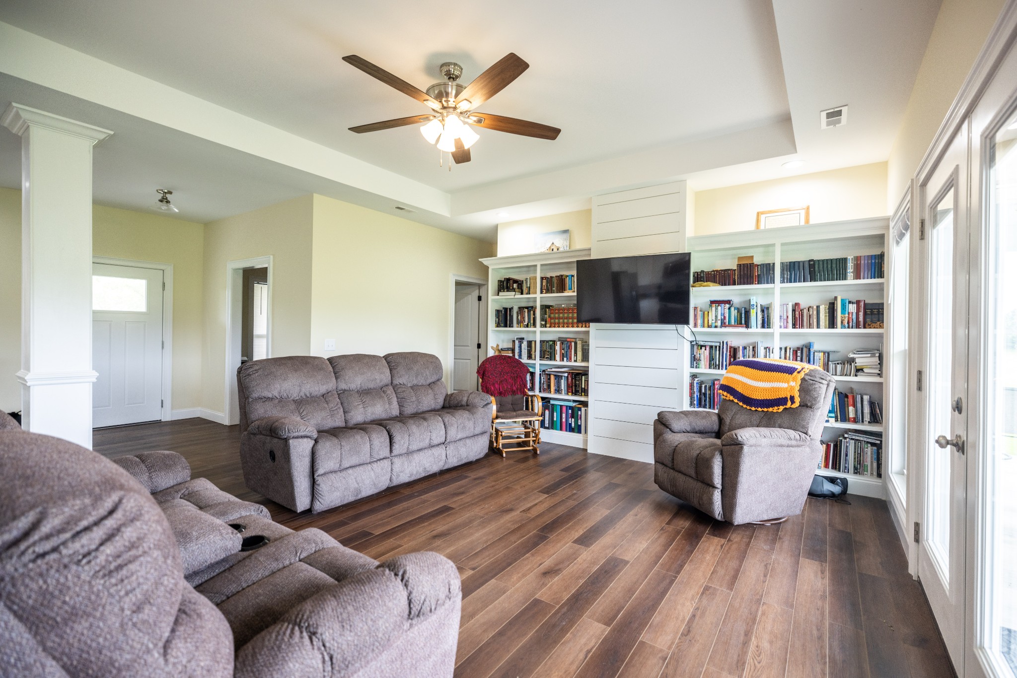 155 Colonial Road Hohenwald, TN 38462 - Photo 13 of 36 a living room with furniture and a wooden floor