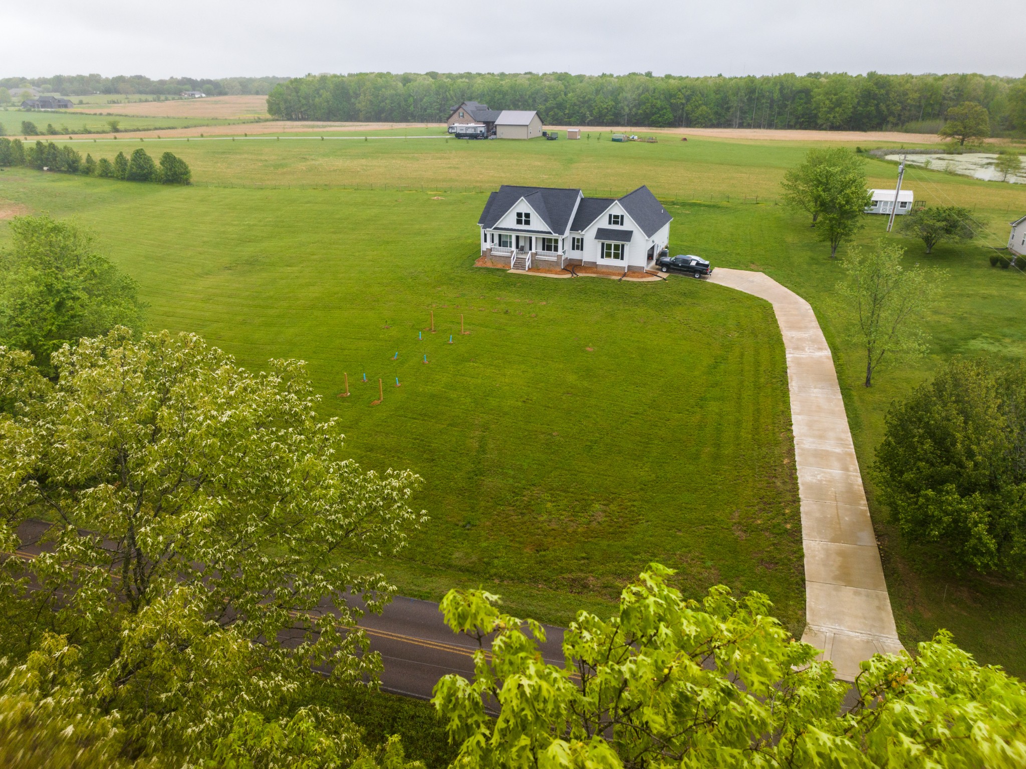 155 Colonial Road Hohenwald, TN 38462 - Photo 33 of 36 a view of a lake with a big yard