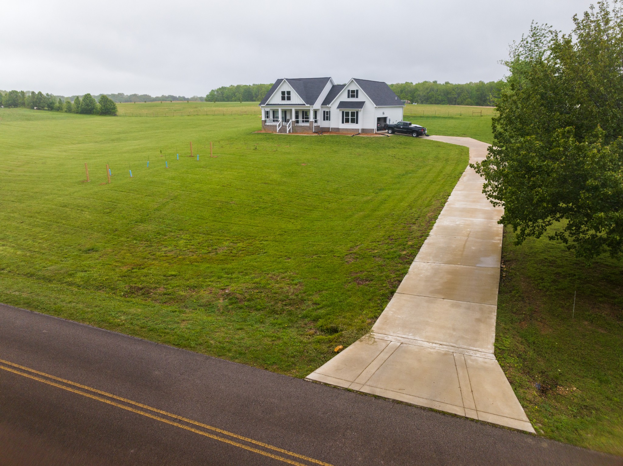 155 Colonial Road Hohenwald, TN 38462 - Photo 4 of 36 a view of a lake with a big yard