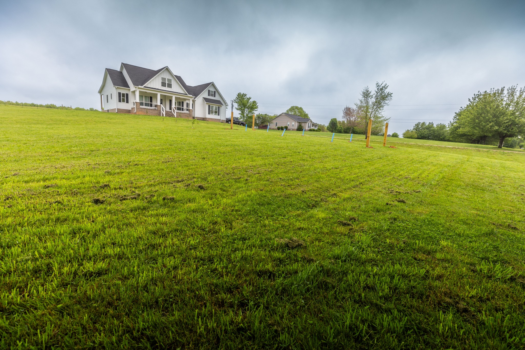 155 Colonial Road Hohenwald, TN 38462 - Photo 6 of 36 a front view of a house with a yard