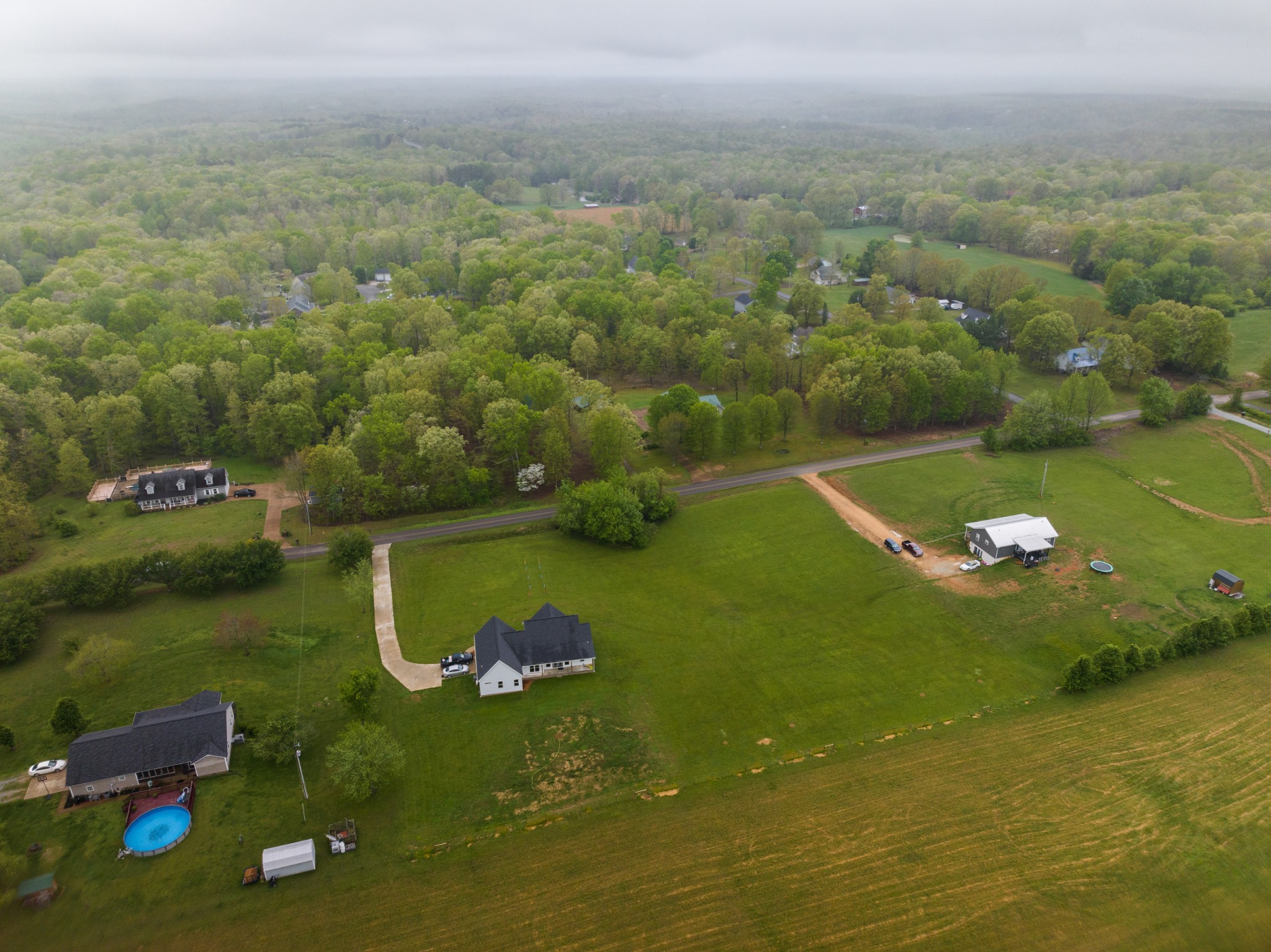 155 Colonial Road Hohenwald, TN 38462 - Photo 9 of 36 a view of a golf course with chairs