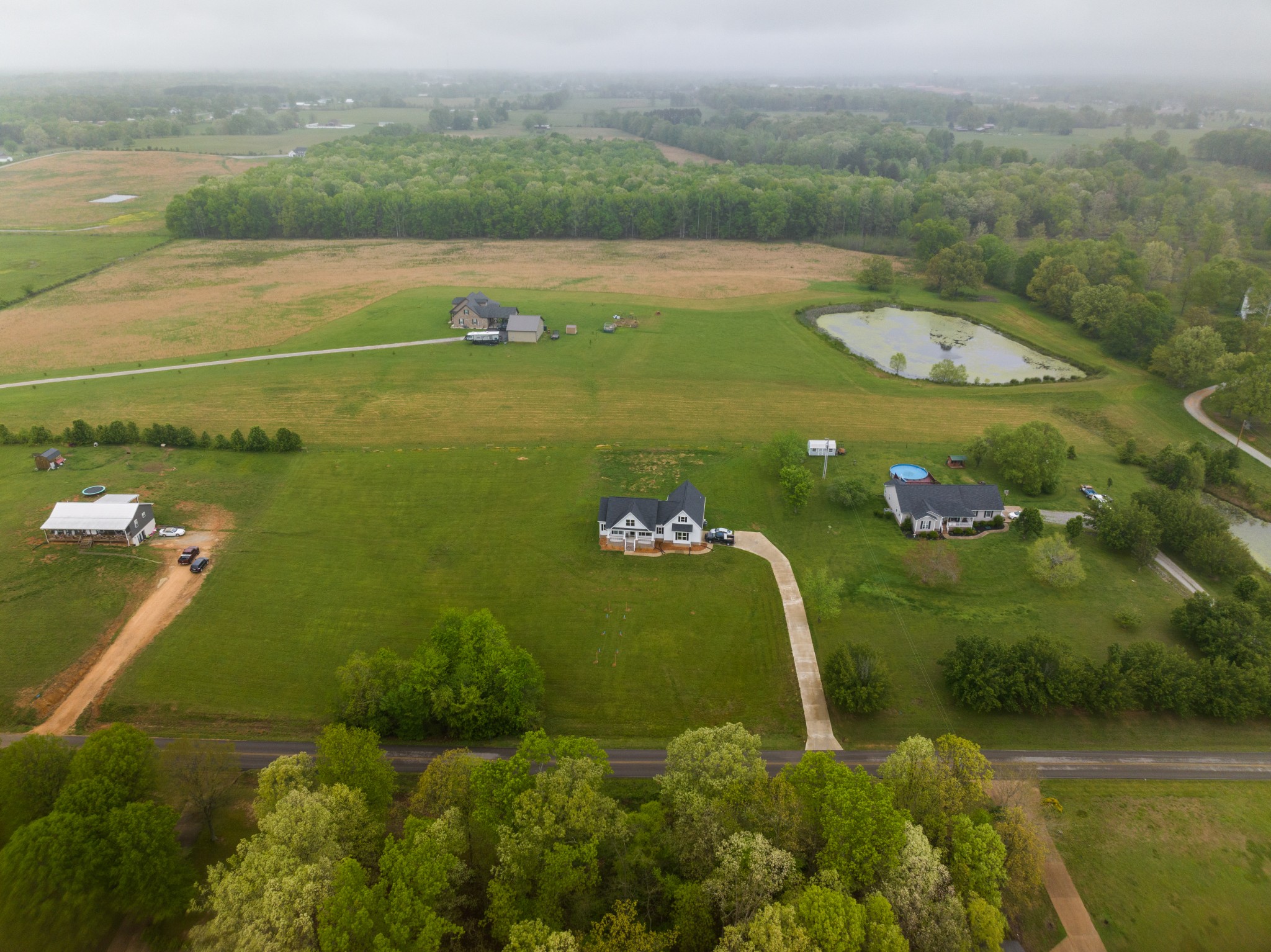 155 Colonial Road Hohenwald, TN 38462 - Photo 10 of 36 a view of a lake with a yard