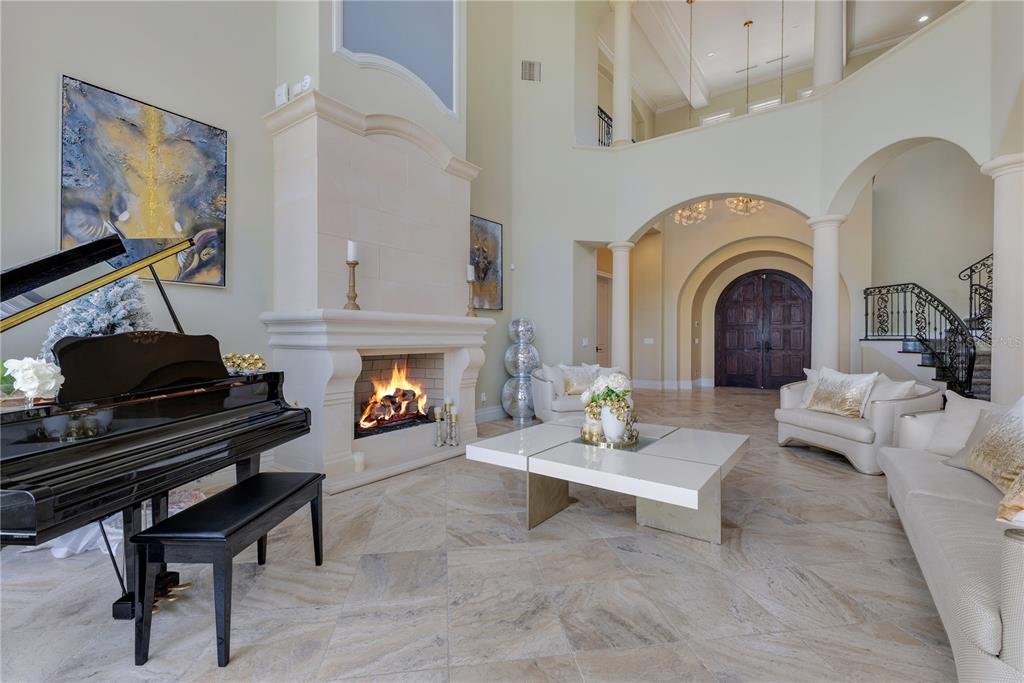 11103 Bridge House Road Windermere, FL 34786 - Photo 11 of 90 a living room with furniture and a fireplace