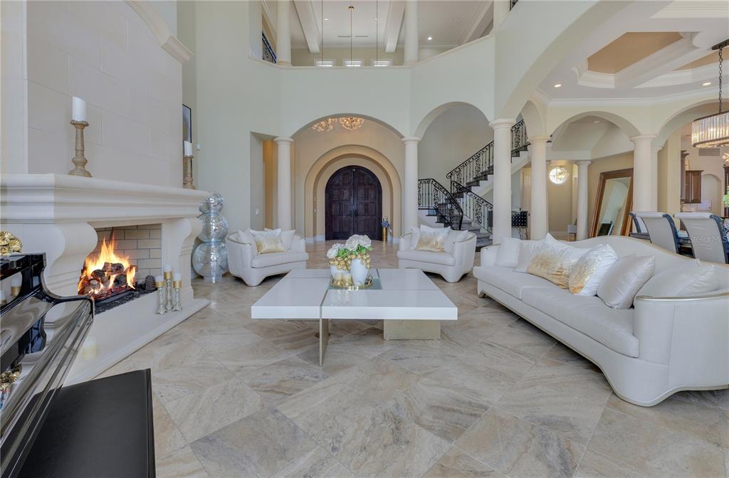 11103 Bridge House Road Windermere, FL 34786 - Photo 12 of 90 a living room with furniture and a fireplace