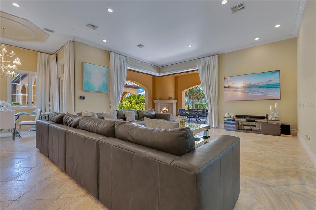 11103 Bridge House Road Windermere, FL 34786 - Photo 26 of 90 a living room with furniture and a large window