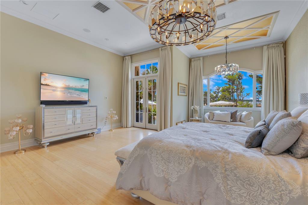 11103 Bridge House Road Windermere, FL 34786 - Photo 32 of 90 a bedroom with a bed and a flat screen tv