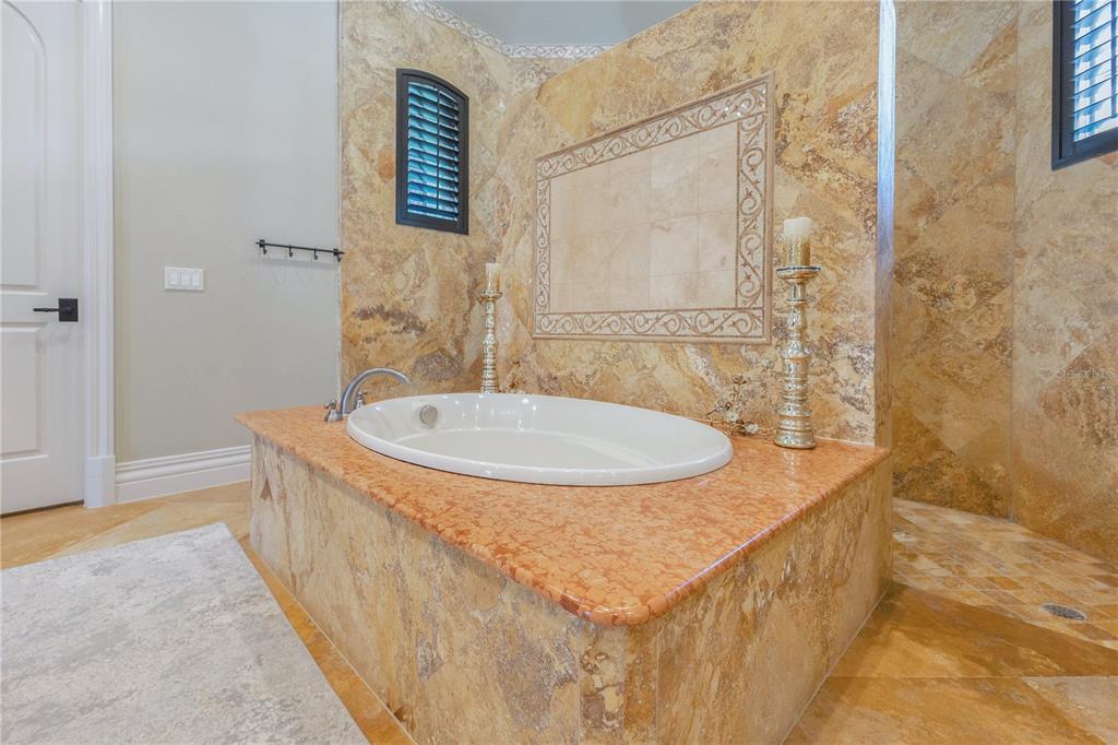 11103 Bridge House Road Windermere, FL 34786 - Photo 40 of 90 a bathroom with a sink and a mirror