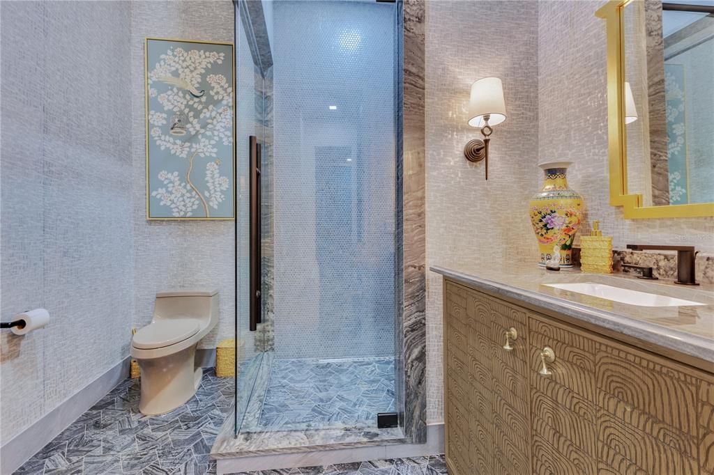 11103 Bridge House Road Windermere, FL 34786 - Photo 58 of 90 a bathroom with a granite countertop sink a toilet and shower