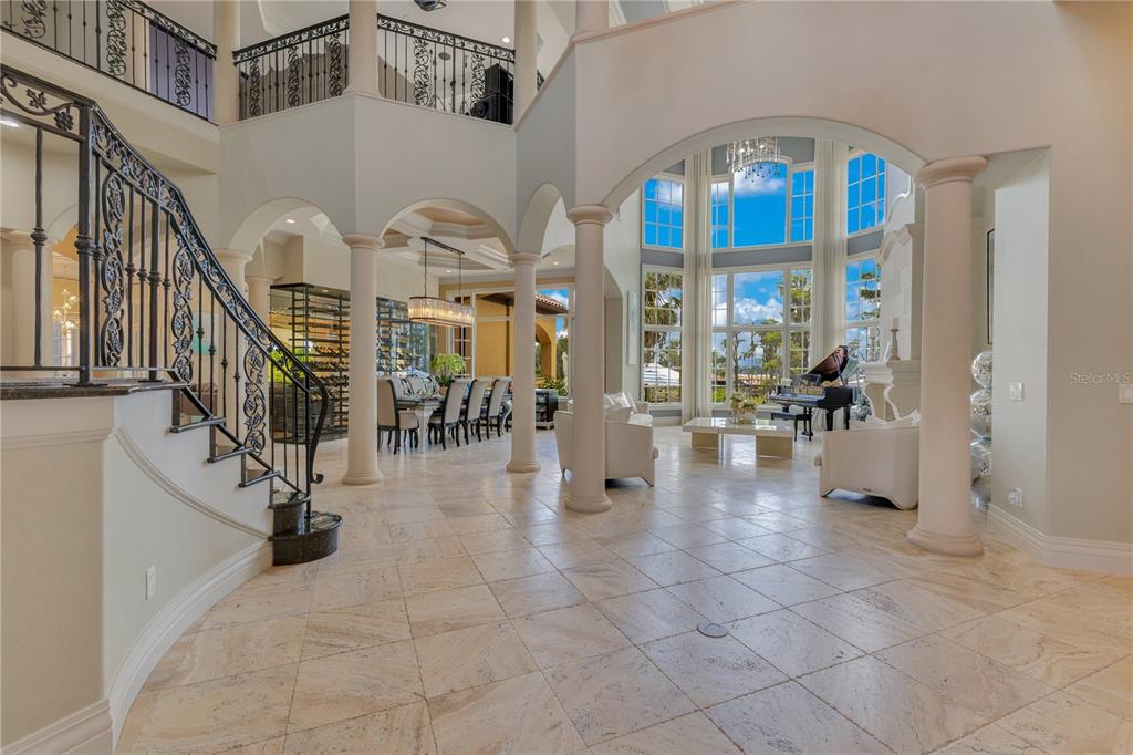 11103 Bridge House Road Windermere, FL 34786 - Photo 6 of 90 a view of entryway and hall with dining room