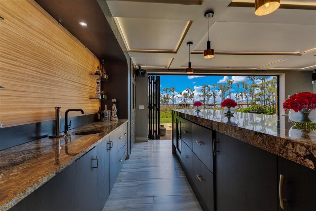 11103 Bridge House Road Windermere, FL 34786 - Photo 68 of 90 a hallway with beautiful frames and dining table