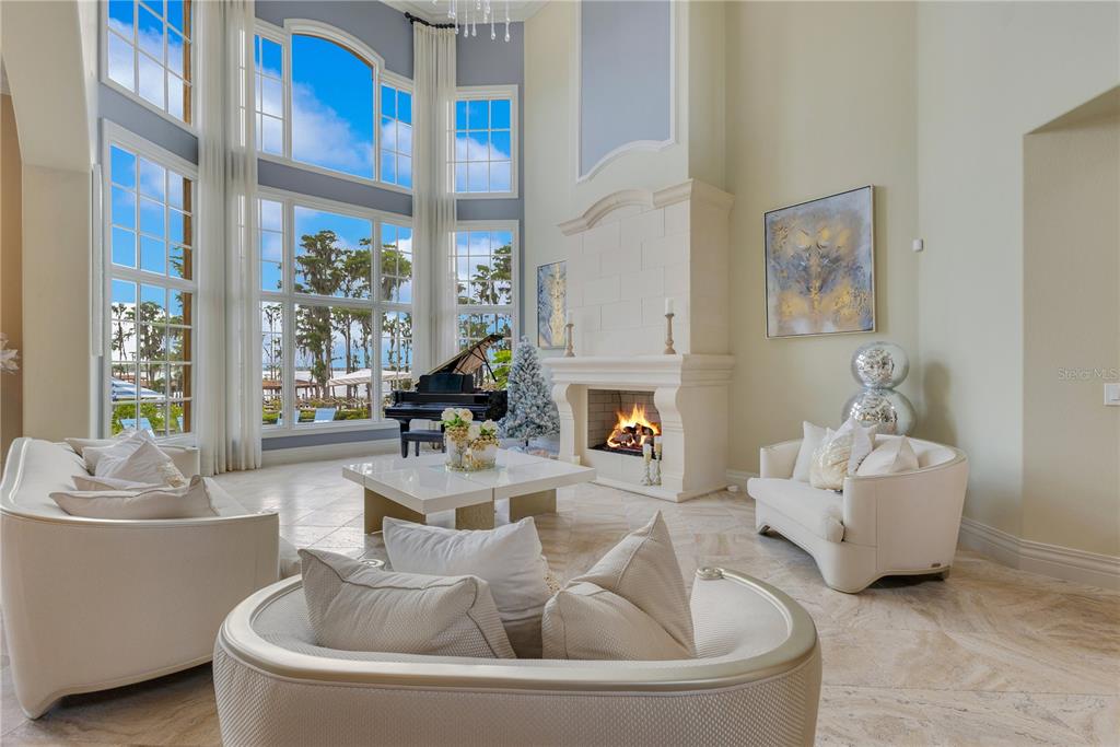 11103 Bridge House Road Windermere, FL 34786 - Photo 7 of 90 a living room with furniture and a fireplace