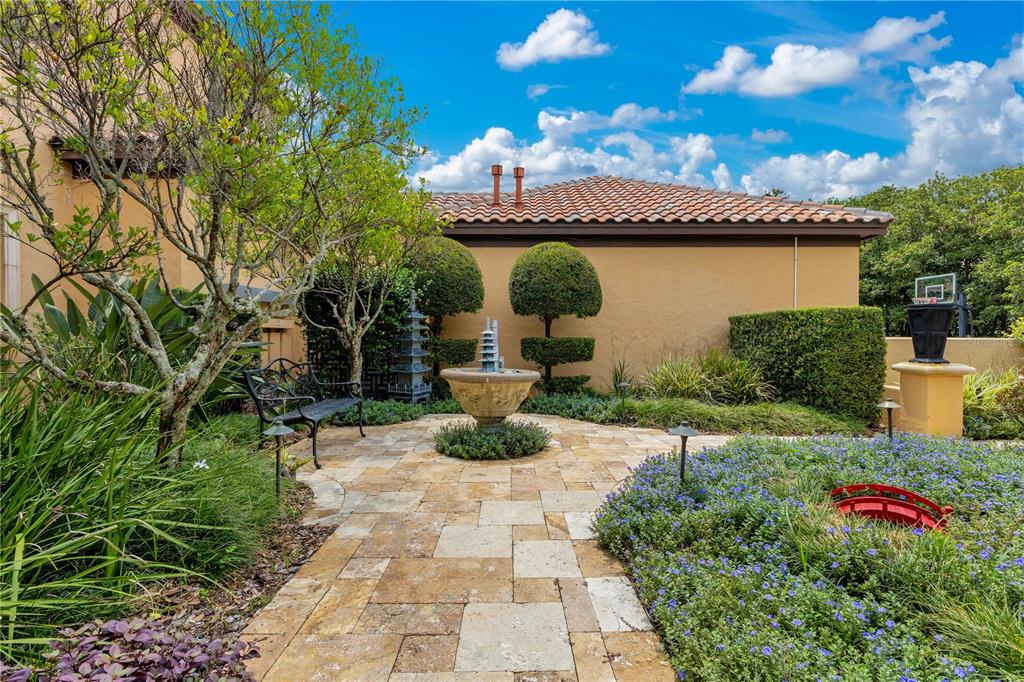 11103 Bridge House Road Windermere, FL 34786 - Photo 78 of 90 a view of a garden with potted plants