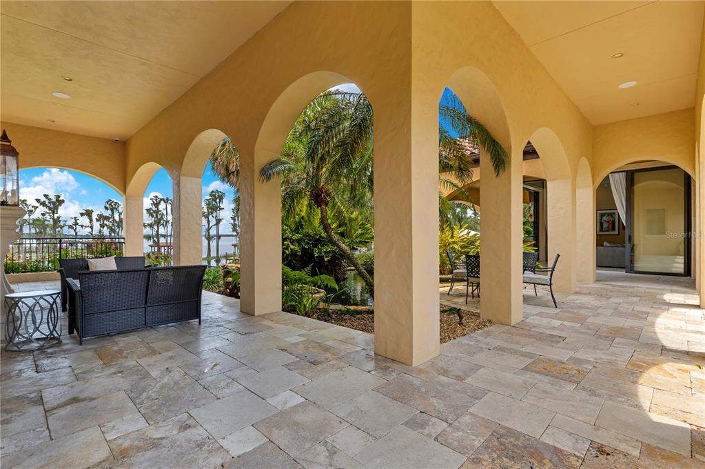 11103 Bridge House Road Windermere, FL 34786 - Photo 81 of 90 a view of a house with a yard and sitting area