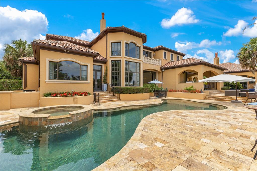 11103 Bridge House Road Windermere, FL 34786 - Photo 83 of 90 a front view of a house with swimming pool