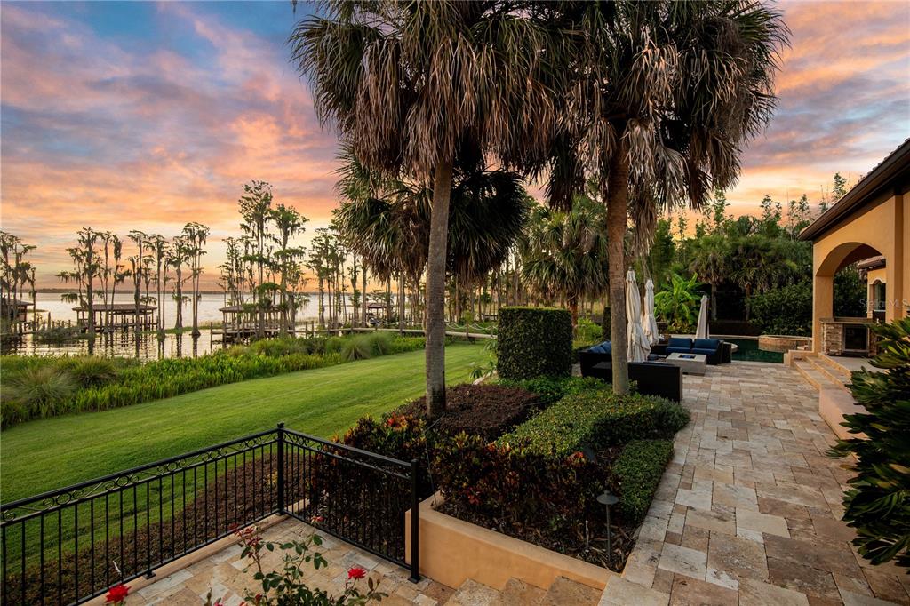 11103 Bridge House Road Windermere, FL 34786 - Photo 88 of 90 a view of a garden with swimming pool and sitting area