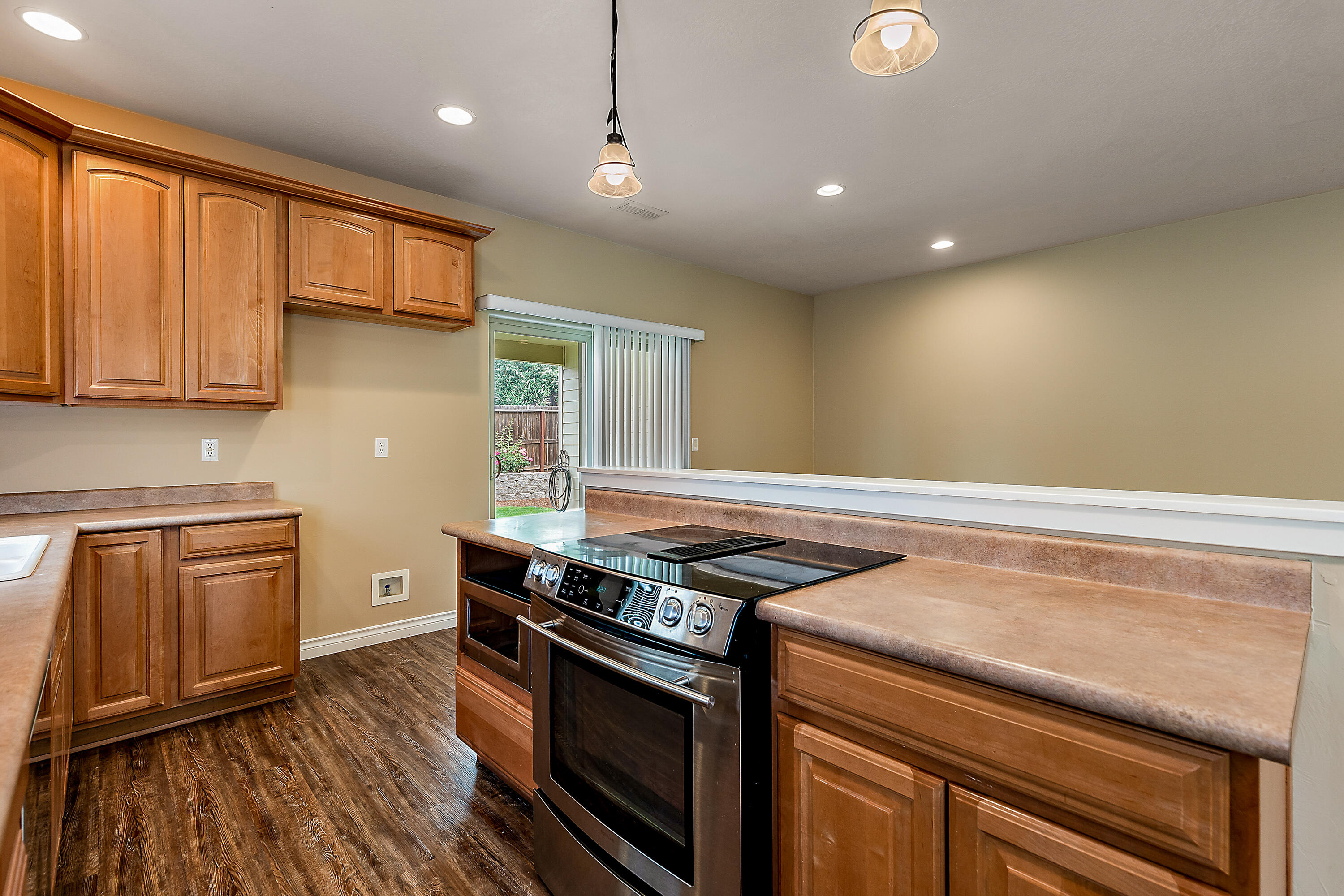 948 Win Way Eagle Point, OR 97524 - Photo 11 of 32 a kitchen that has a sink stainless steel appliances and cabinets