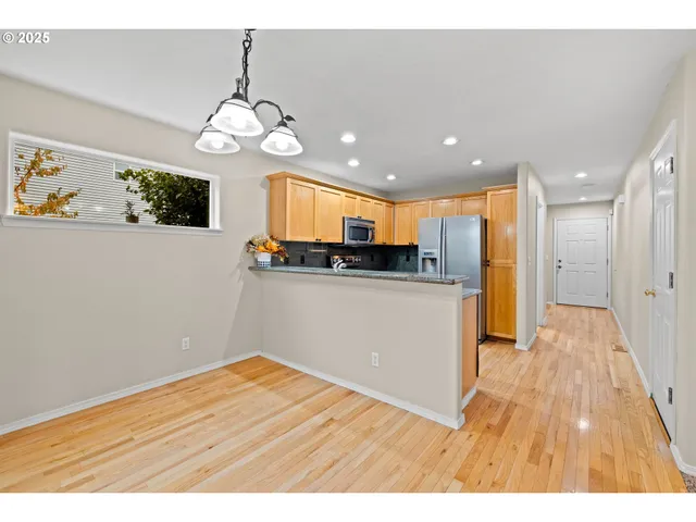 a view of a kitchen from the hallway