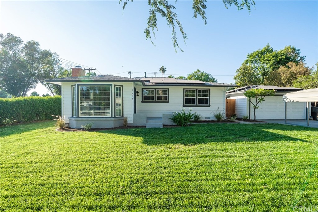 7485 Kingsley Way Riverside, CA 92504 - Photo 1 of 1 a front view of house with yard and green space