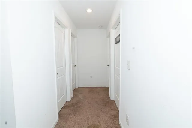 a view of a hallway with closet