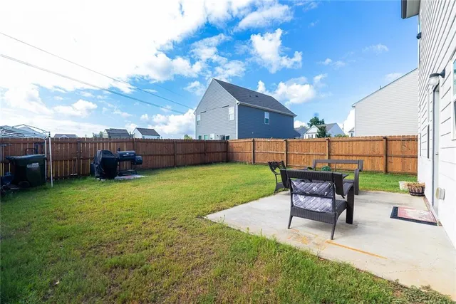 a view of a backyard with furniture