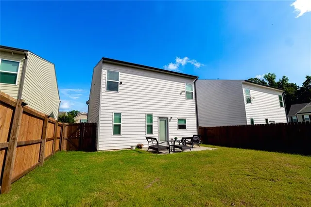 a aerial view of a house with swimming pool